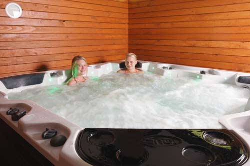Ease those tired muscles in the spa after a day in the Abel Tasman.